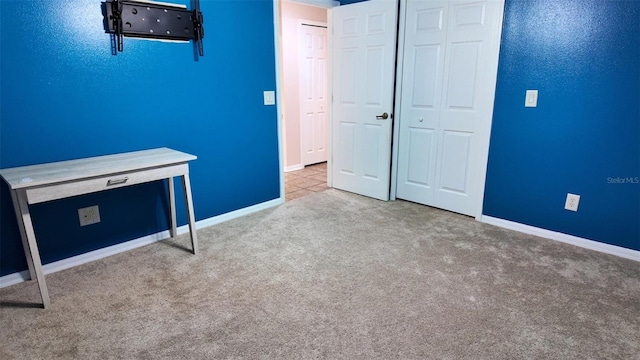 13653 Artesa Bell Dr, Riverview, FL 33579 - unfurnished bedroom with carpet flooring, baseboards, and a closet