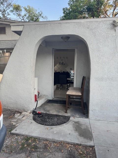 3713 E Clifton St, Tampa, FL 33610 - doorway to property featuring stucco siding