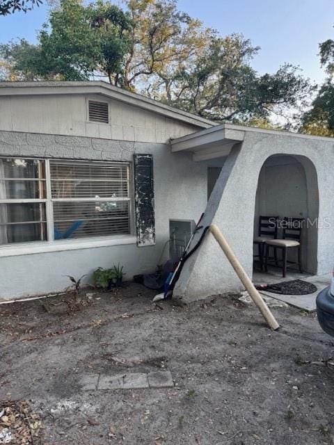3713 E Clifton St, Tampa, FL 33610 - view of side of home with stucco siding