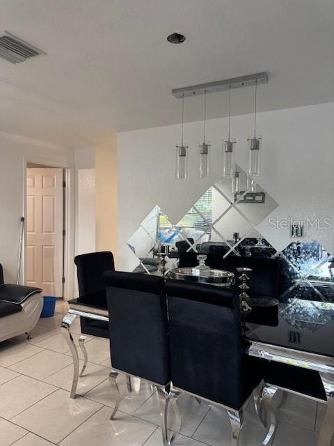 3713 E Clifton St, Tampa, FL 33610 - living room featuring visible vents
