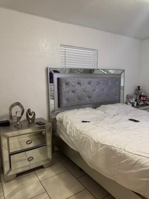 3713 E Clifton St, Tampa, FL 33610 - bedroom with light tile patterned flooring