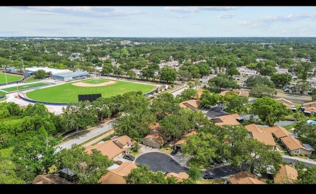 aerial view of property and surrounding area with nearby suburban area