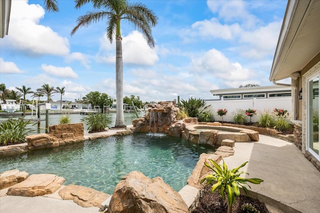 view of swimming pool with a pool with connected hot tub