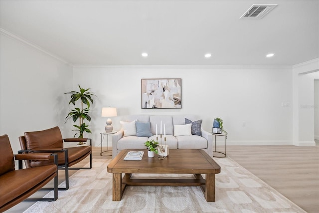 living area featuring crown molding, recessed lighting, light wood-type flooring, and visible vents