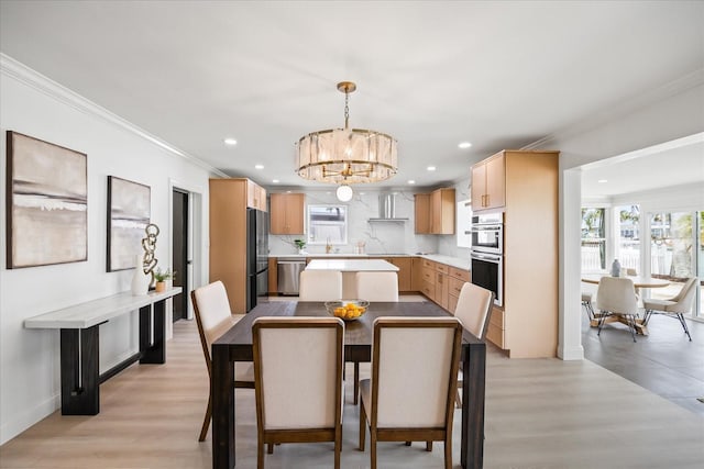 dining space featuring an inviting chandelier, recessed lighting, and light wood-style floors