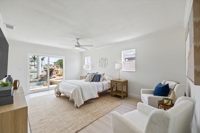 bedroom with visible vents, ornamental molding, access to outside, a ceiling fan, and light wood finished floors