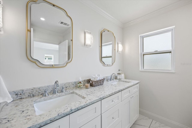 bathroom featuring crown molding, a sink, marble finish floor, and baseboards