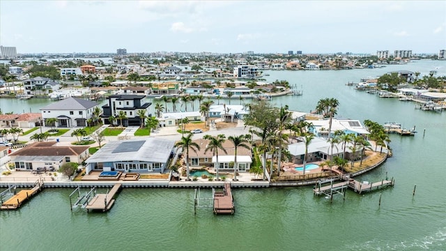 bird's eye view featuring a water view and a residential view