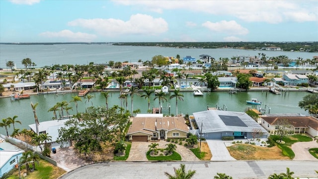 birds eye view of property with a residential view and a water view
