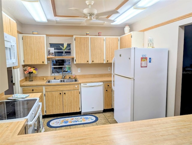 kitchen with a sink, white appliances, light countertops, a ceiling fan, and light tile patterned floors