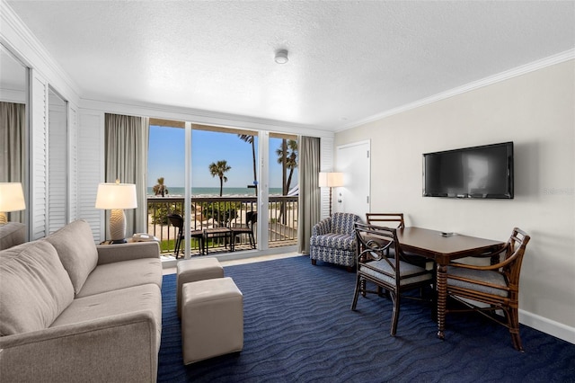 living area featuring ornamental molding, carpet floors, a textured ceiling, floor to ceiling windows, and baseboards