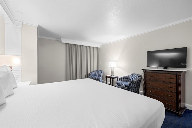 bedroom with ornamental molding, baseboards, and dark carpet