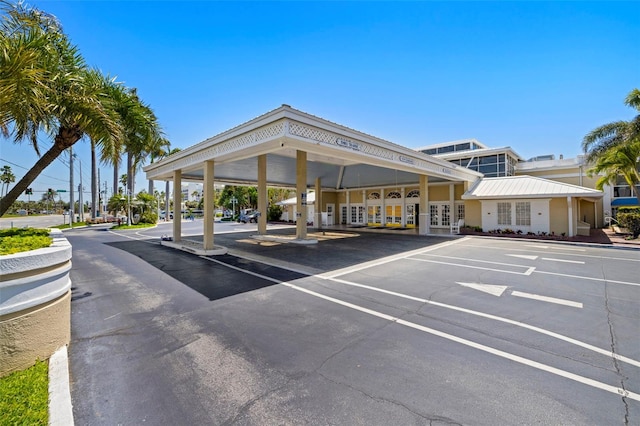 partially covered parking lot with french doors