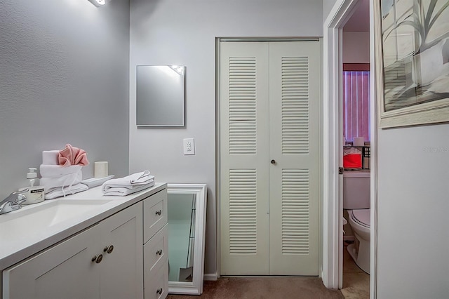56 Pine Trak Unit 101E, Ocala, FL 34472 - bathroom with vanity and toilet