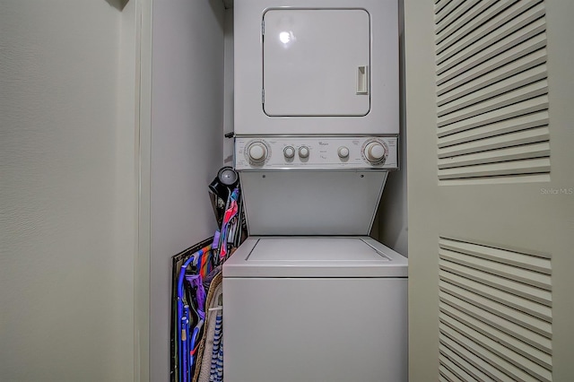 56 Pine Trak Unit 101E, Ocala, FL 34472 - laundry room with stacked washer and clothes dryer and laundry area