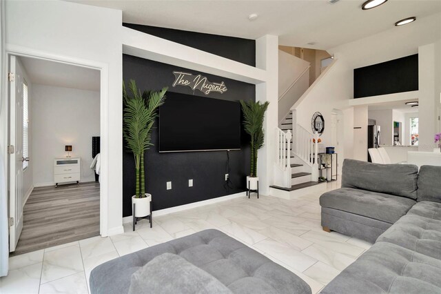 living room with stairway, recessed lighting, marble look tile flooring, and baseboards
