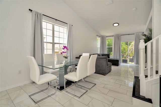 dining area with light marble finish flooring, vaulted ceiling, stairs, baseboards, and recessed lighting