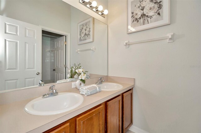 full bathroom with double vanity and a shower