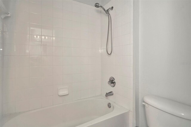 full bathroom with toilet and  shower combination