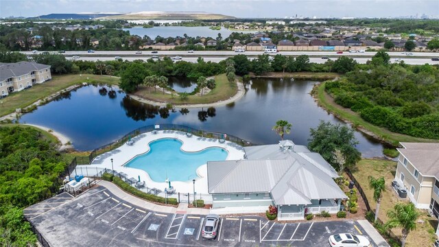 aerial view of a nearby body of water and a pool