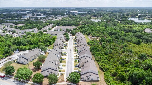 aerial view of residential area featuring a nearby body of water