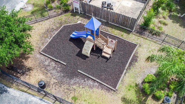 view of home's community with fence