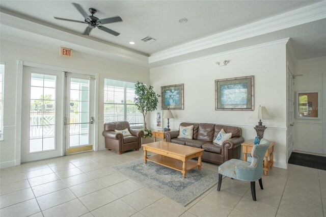 living room featuring light tile patterned floors, crown molding, a ceiling fan, a raised ceiling, and recessed lighting
