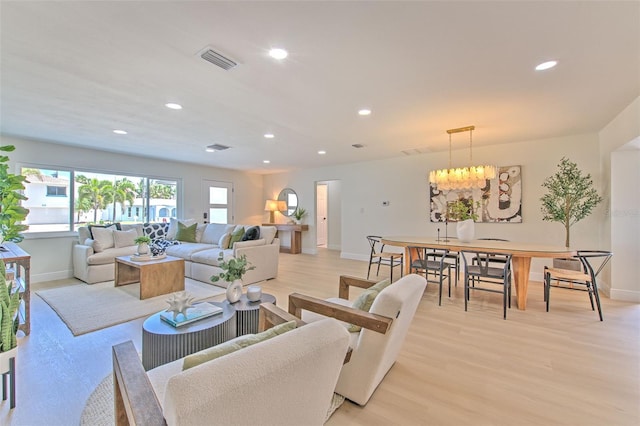 living area with baseboards and recessed lighting
