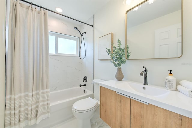 full bath with toilet, shower / bath combo, and vanity