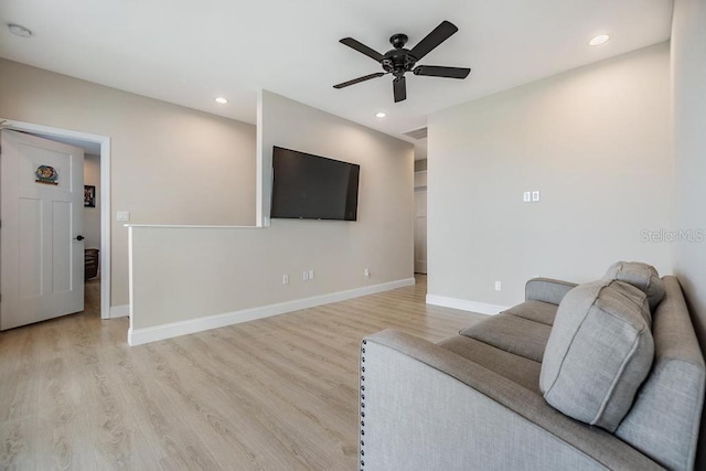 living area with ceiling fan, recessed lighting, baseboards, and wood finished floors