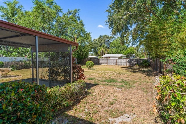 view of yard with a fenced backyard