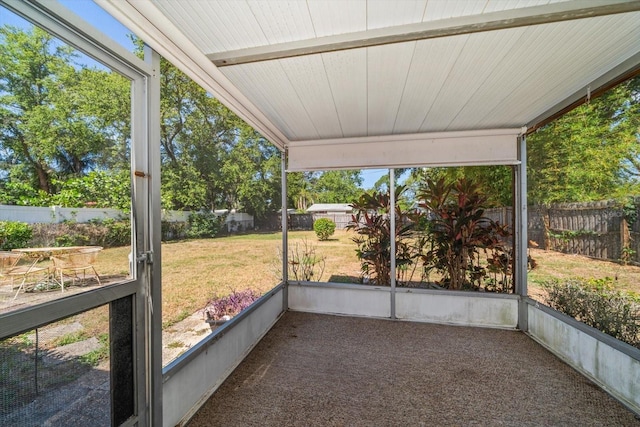 unfurnished sunroom featuring a wealth of natural light