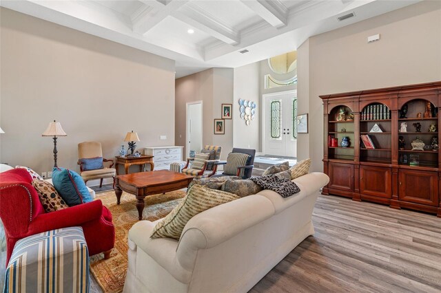 7340 W Dr, Wesley Chapel, FL 33544 - living area with wood finished floors, coffered ceiling, beam ceiling, crown molding, and visible vents
