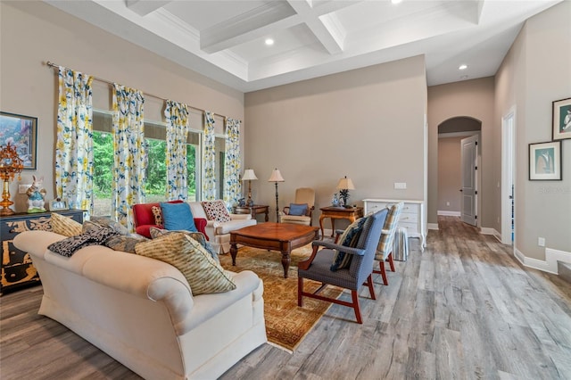 7340 W Dr, Wesley Chapel, FL 33544 - living room with coffered ceiling, beamed ceiling, arched walkways, and light wood-style floors