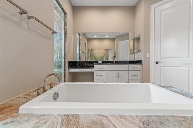 7340 W Dr, Wesley Chapel, FL 33544 - full bathroom featuring a stall shower, vanity, and a bath