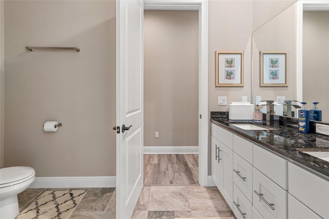 7340 W Dr, Wesley Chapel, FL 33544 - full bath featuring double vanity, baseboards, and a sink
