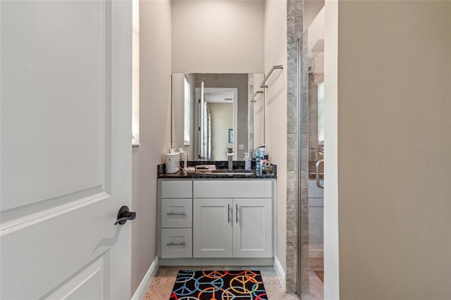 7340 W Dr, Wesley Chapel, FL 33544 - full bathroom featuring a stall shower, vanity, and baseboards