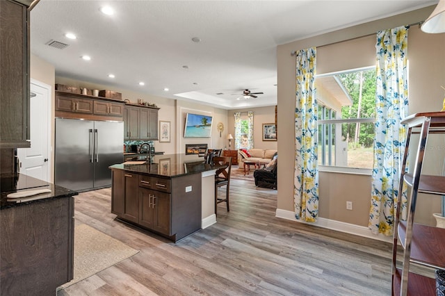 7340 W Dr, Wesley Chapel, FL 33544 - kitchen featuring built in refrigerator, light wood-type flooring, dark brown cabinets, and recessed lighting