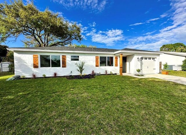 single story home featuring stucco siding, driveway, a front yard, and a garage
