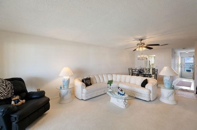 5925 Shore Blvd S Unit 602, Gulfport, FL 33707 - carpeted living room featuring a textured ceiling and ceiling fan with notable chandelier