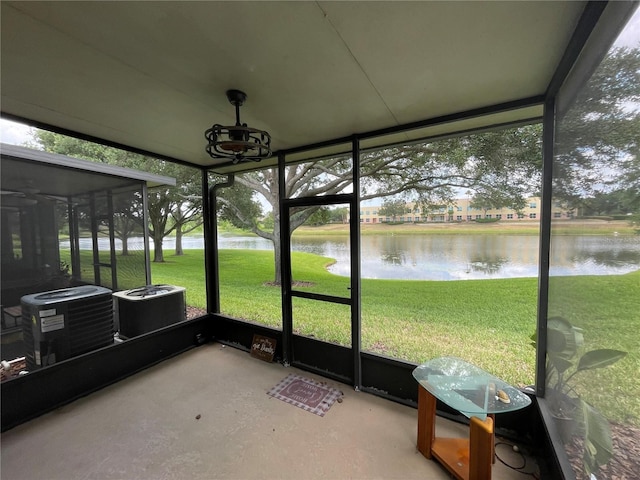 sunroom with a water view and plenty of natural light