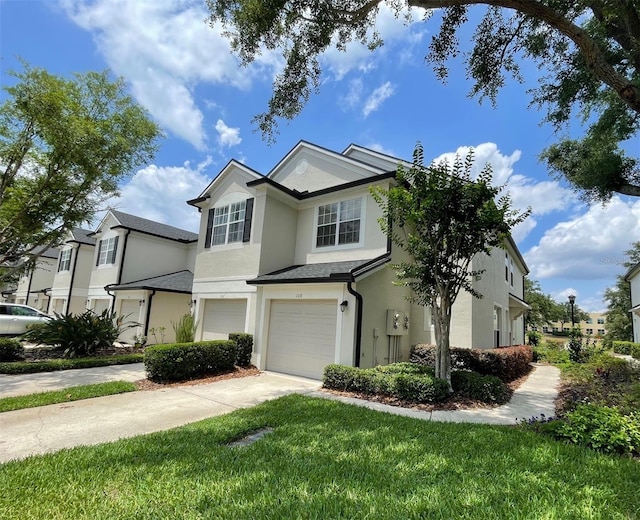 view of front facade with stucco siding, a garage, and concrete driveway