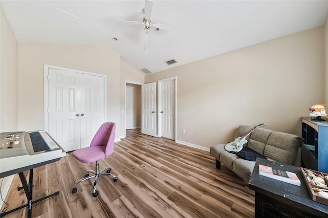 office with wood finished floors, vaulted ceiling, baseboards, and a ceiling fan