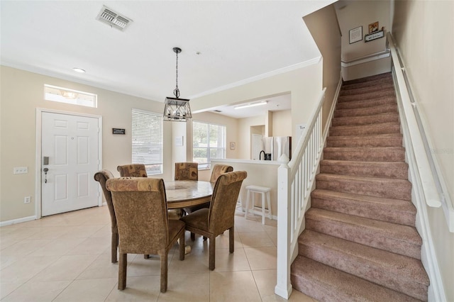 dining space featuring stairs, light tile patterned flooring, baseboards, a chandelier, and crown molding