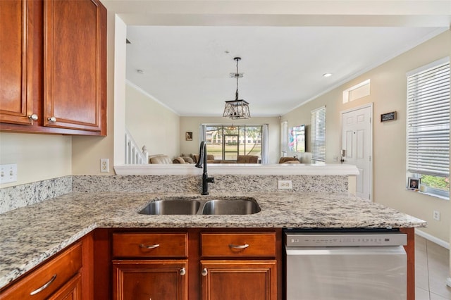 kitchen with stainless steel dishwasher, a sink, open floor plan, ornamental molding, and healthy amount of natural light