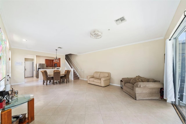 living area with baseboards, light tile patterned floors, ornamental molding, and stairway