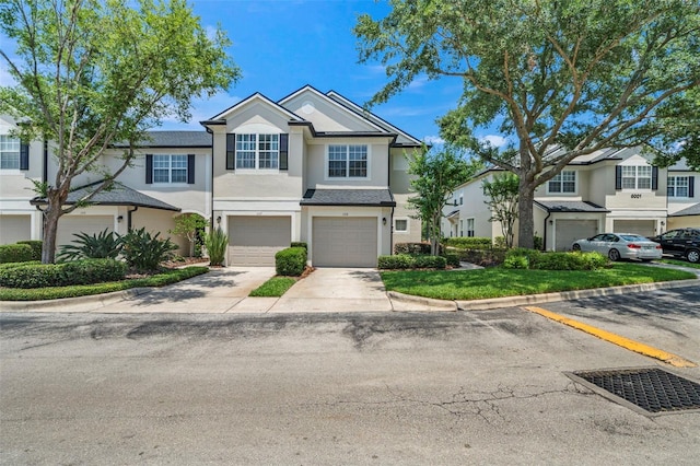 view of property with stucco siding and an attached garage