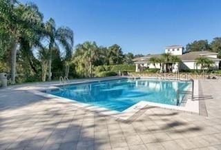 outdoor pool featuring a patio
