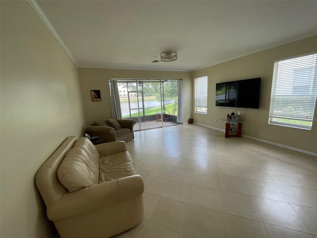 living room with crown molding, baseboards, and light tile patterned flooring