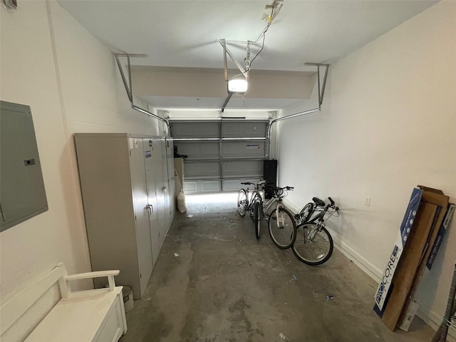 garage with electric panel and a garage door opener